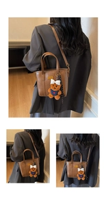 Detail showing brown leather bucket bag with teddy bear charm and checkered ribbon decor