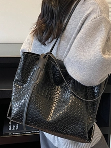 Fashionable black woven leather tote bag for women with large capacity shoulder strap