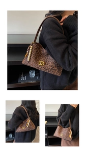 Detail of leopard print shoulder bag with gold hardware and bohemian beaded tassel charm