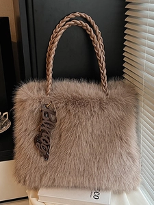 Chic dusty pink faux fur tote bag with braided leather handles and Bonjour charm