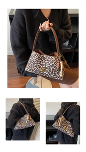 Macro detail of leopard print shoulder bag with gold hardware and beaded tassel
