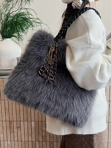 Furry grey faux fur tote bag with braided handles and trendy charm pendants for women