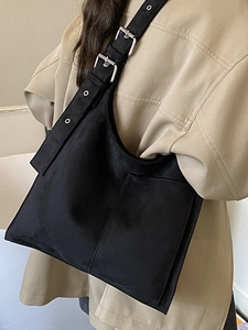 Minimalist black leopard print canvas tote bag with wide strap and metallic eyelets