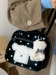 Black polka dot shoulder bag with cute plush puppy and bear charms for daily casual wear