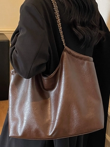 Minimalist large capacity dark brown tote bag with vintage leather texture and chain strap