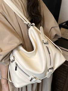 Off-white large capacity tote bag with silver zippers and stylish biker aesthetic details