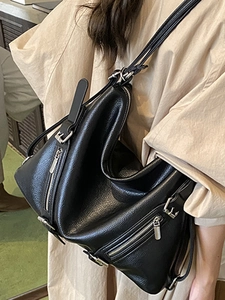 Large black pebbled leather tote bag with geometric design for stylish daily commuting
