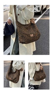 Detail of leopard print slouchy dumpling bag featuring leather logo and plush bear charm