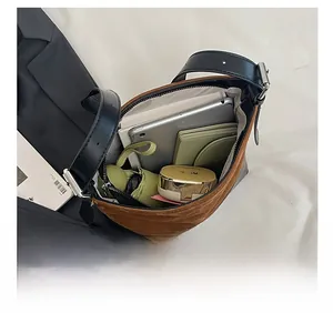 Detail shot of the large capacity interior showing iPad, wallet and umbrella storage