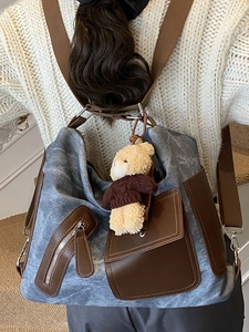 Retro denim and brown leather patchwork backpack with a cute plush bear pendant accessory