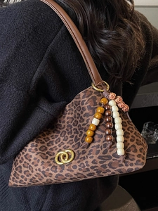 Retro leopard print crescent underarm bag with gold rings and colorful wooden bead tassel