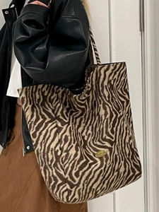Chic zebra print canvas tote bag with large capacity and vintage gold logo plate