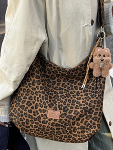 Retro leopard print hobo shoulder bag with plush dog charm for large capacity commuting