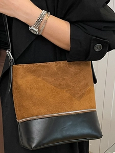 Chic two-tone shoulder bag with brown suede and black leather patchwork design