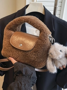 Caramel plush crossbody bag with tassel detail and rabbit charm for autumn