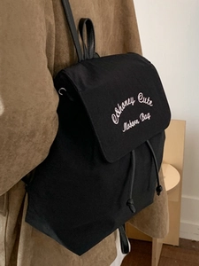 Sac à dos tendance en toile noire avec broderie et cordon de serrage pour femmes