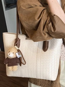 Retro large capacity woven tote bag in cream white with brown handles and a cute bear charm