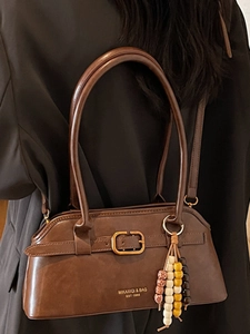 Vintage brown shoulder bag with a curved silhouette and colorful beaded charms