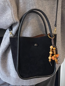 Large black faux suede bucket bag with wooden beads and adjustable shoulder strap