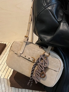 Retro beige leather shoulder bag with bingo charm and vintage pleated texture details