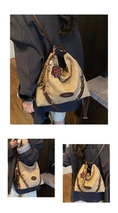 Detail view of beige canvas tote bag with brown leather straps and cute bear charm