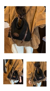 Detail view of black canvas backpack with brown leather straps and oval logo patch