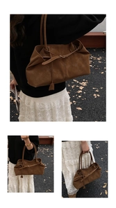 Detailed close-up of dark brown tote bag with matte texture and decorative buckle detail