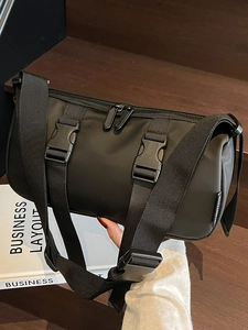 Chic black cylinder nylon crossbody sports bag with wide adjustable strap and buckles