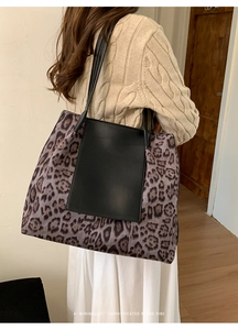 Minimalist leopard print tote bag with black leather patch and slim shoulder straps
