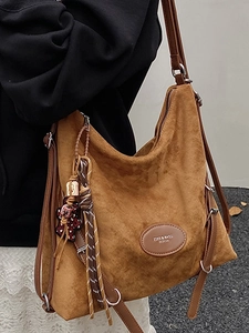 Brown suede tote bag with bear charm and silver buckles for women's casual autumn wear