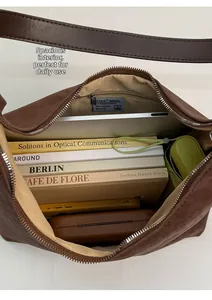 Spacious interior of leopard tote bag showing laptop, umbrella and inner zipper pocket