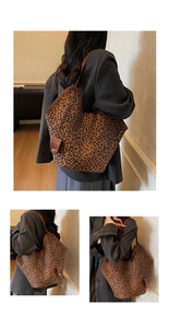 Detail view of large leopard print tote bag with brown leather handles and spacious interior