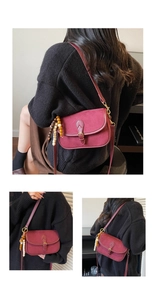 Macro view of vintage burgundy crossbody bag with matte texture and colorful beads