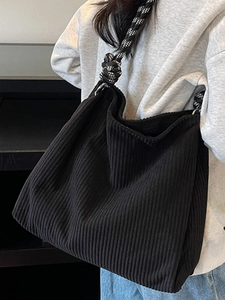 Minimalist black corduroy tote bag for women featuring stylish wide checkered strap design