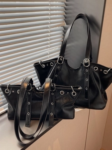 Vintage black leather tote bags in large and small sizes with silver eyelet details