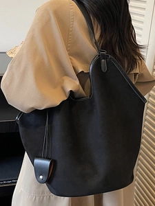 Minimalist large black suede hobo bag for women with leather trim and shoulder strap