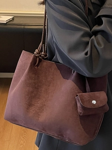 Minimalist brown suede tote bag with detachable pouch and knotted leather strap details
