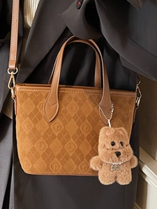Vintage brown suede bucket bag with quilted patterns and cute bear charm for women