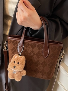 Vintage brown monogram suede tote bag with plush puppy charm and crossbody strap
