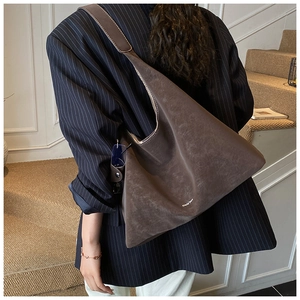 Brown suede tote bag with large capacity shown in a stylish lifestyle back view