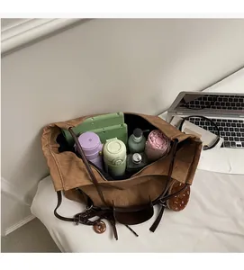 Top view of spacious brown canvas tote bag interior showing large storage capacity