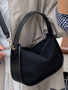 Vintage black suede and leather hobo bag for women with minimalist shoulder strap design