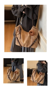 Detail of vintage brown tote bag with decorative straps and plush doughnut pendants