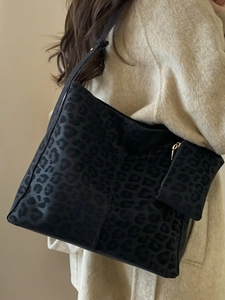 Large leopard print bucket tote bag in black faux fur with matching small pouch charm