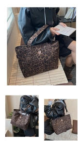 Detailed view of leopard print tote bag with bear embroidery and spacious interior