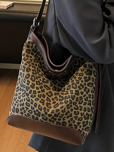 Stylish leopard print bucket bag for women with leather straps and shoulder carry style