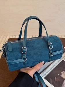 Retro navy blue suede bowling bag with dual handles and detachable shoulder strap