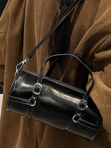 Chic black shiny leather barrel bowling bag with silver buckles and adjustable strap