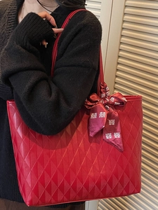 Red quilted tote bag for women with decorative silk ribbon and large capacity design