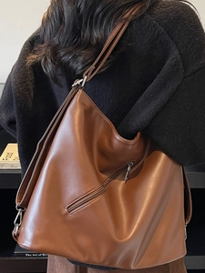 Vintage large brown PU leather tote bag shown in a real-life back view carry mode